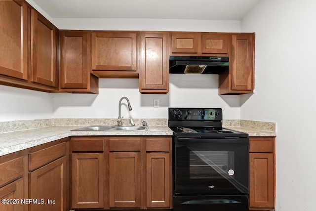 kitchen with a sink, exhaust hood, light countertops, black electric range oven, and brown cabinetry