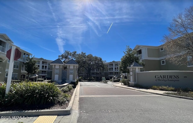 view of street featuring curbs and a residential view