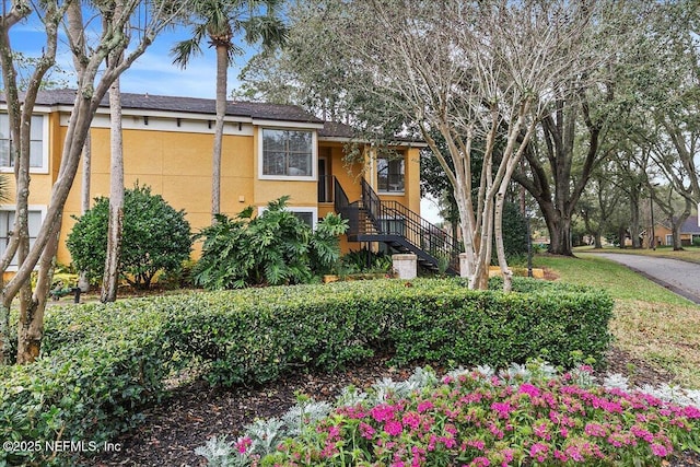 view of side of property featuring stucco siding