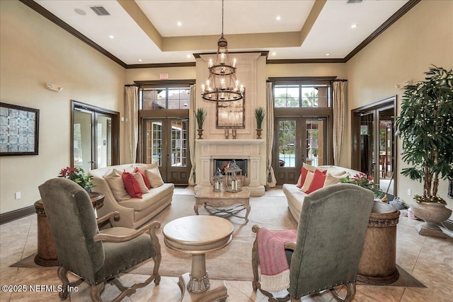 living room featuring french doors, visible vents, baseboards, and a high ceiling