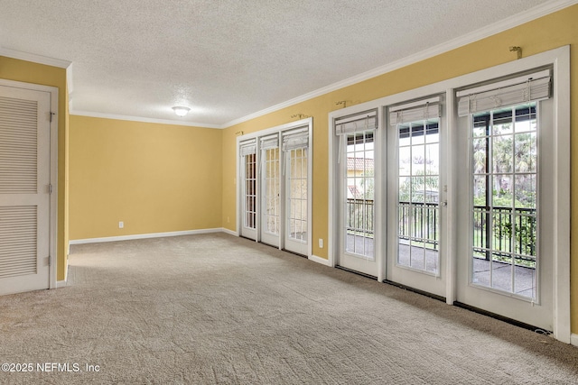 interior space with baseboards, ornamental molding, carpet, a textured ceiling, and french doors