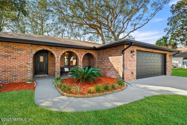 single story home featuring covered porch, concrete driveway, brick siding, and an attached garage