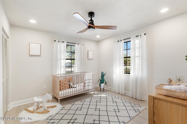 bedroom with multiple windows, a closet, and recessed lighting