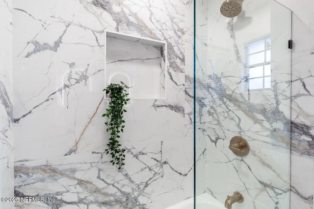 details featuring a combined bath / shower with marble appearance