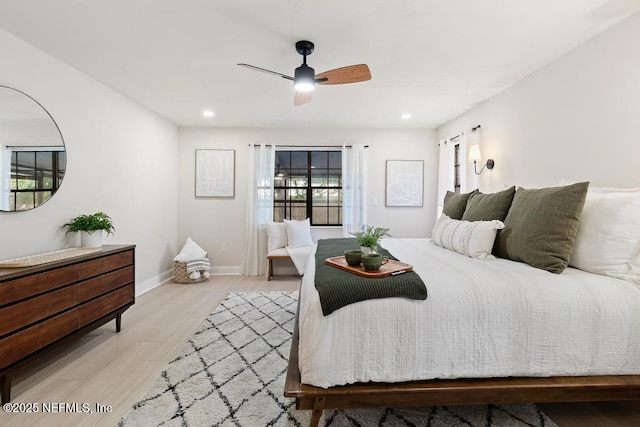 bedroom with ceiling fan, light wood finished floors, recessed lighting, and baseboards