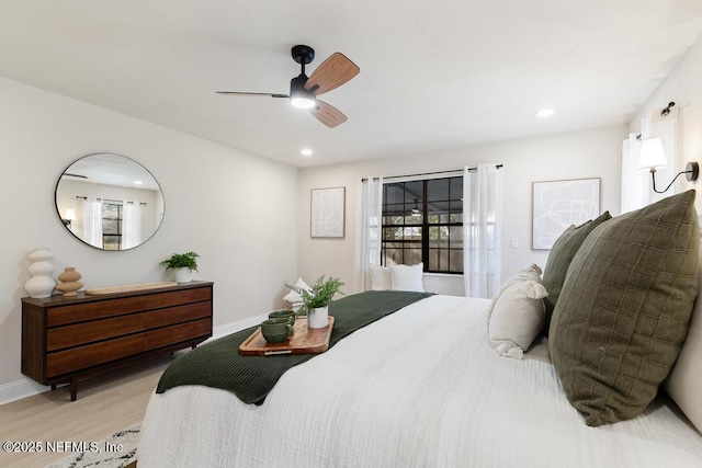 bedroom featuring ceiling fan, recessed lighting, baseboards, and light wood-style floors