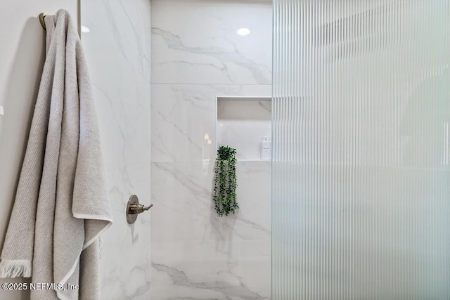 room details with a marble finish shower