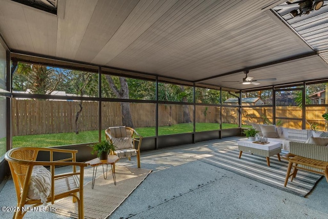 sunroom with a ceiling fan