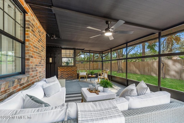 sunroom with ceiling fan