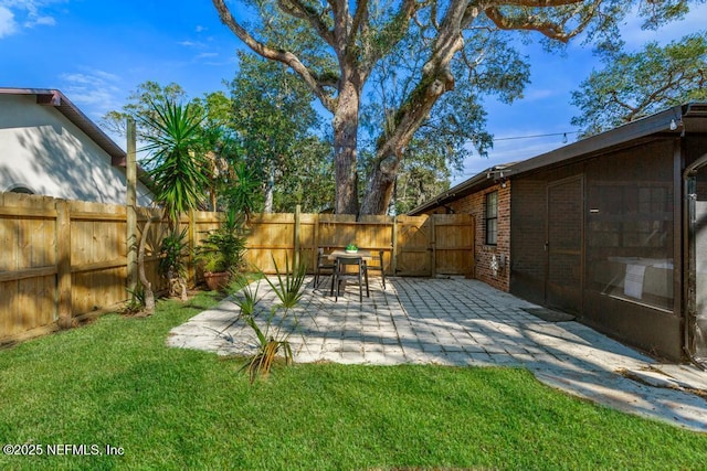 view of yard featuring a patio area and a fenced backyard