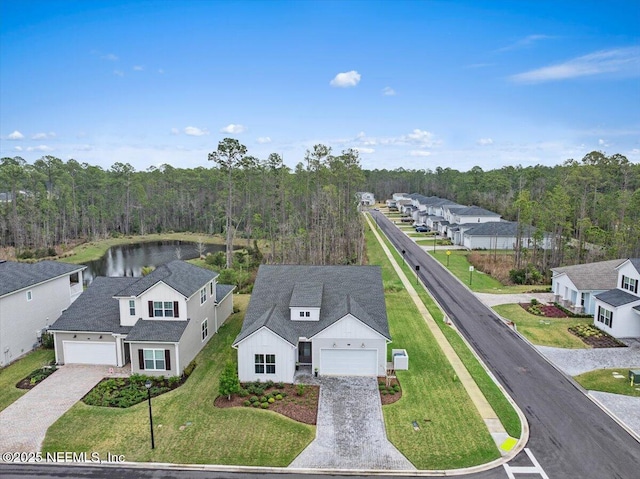 bird's eye view featuring a wooded view