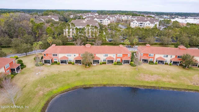 birds eye view of property with a residential view and a water view