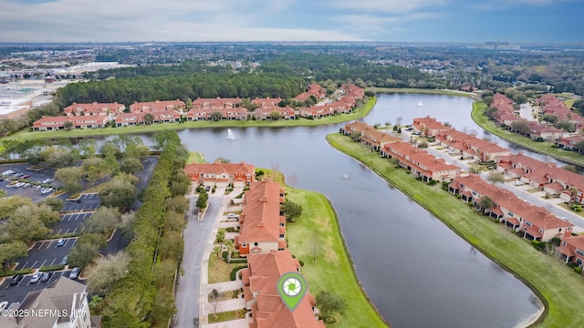 drone / aerial view with a residential view and a water view