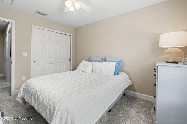 carpeted bedroom with ceiling fan, a closet, visible vents, and baseboards