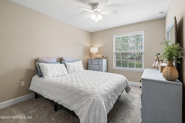 bedroom featuring carpet, baseboards, and a ceiling fan