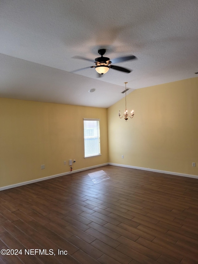 spare room with baseboards, lofted ceiling, dark wood-style floors, a textured ceiling, and ceiling fan with notable chandelier