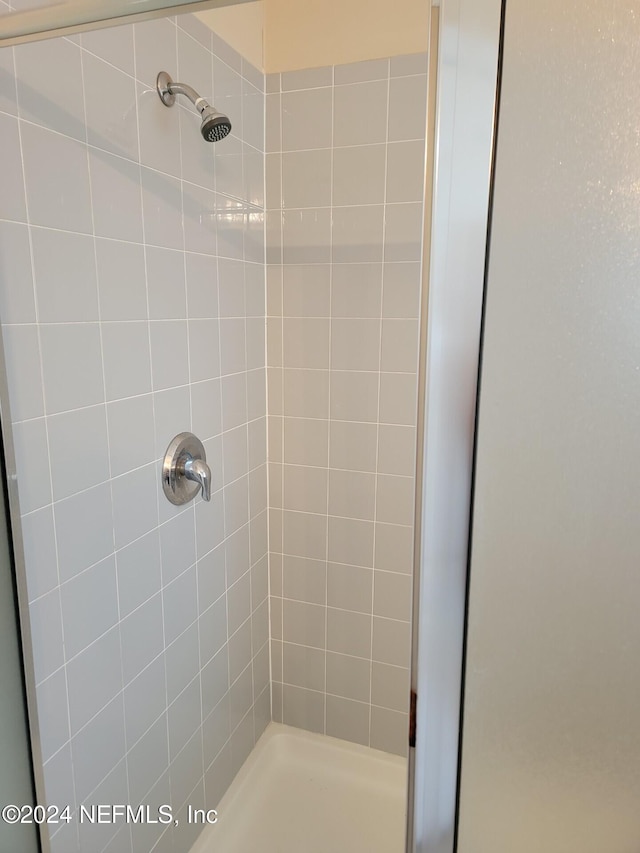 bathroom with a stall shower