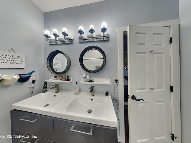 bathroom with a sink and double vanity