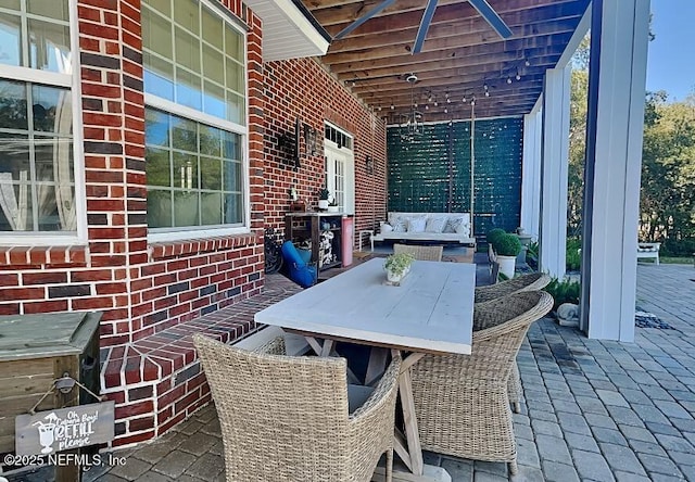 view of patio featuring outdoor dining area and an outdoor living space