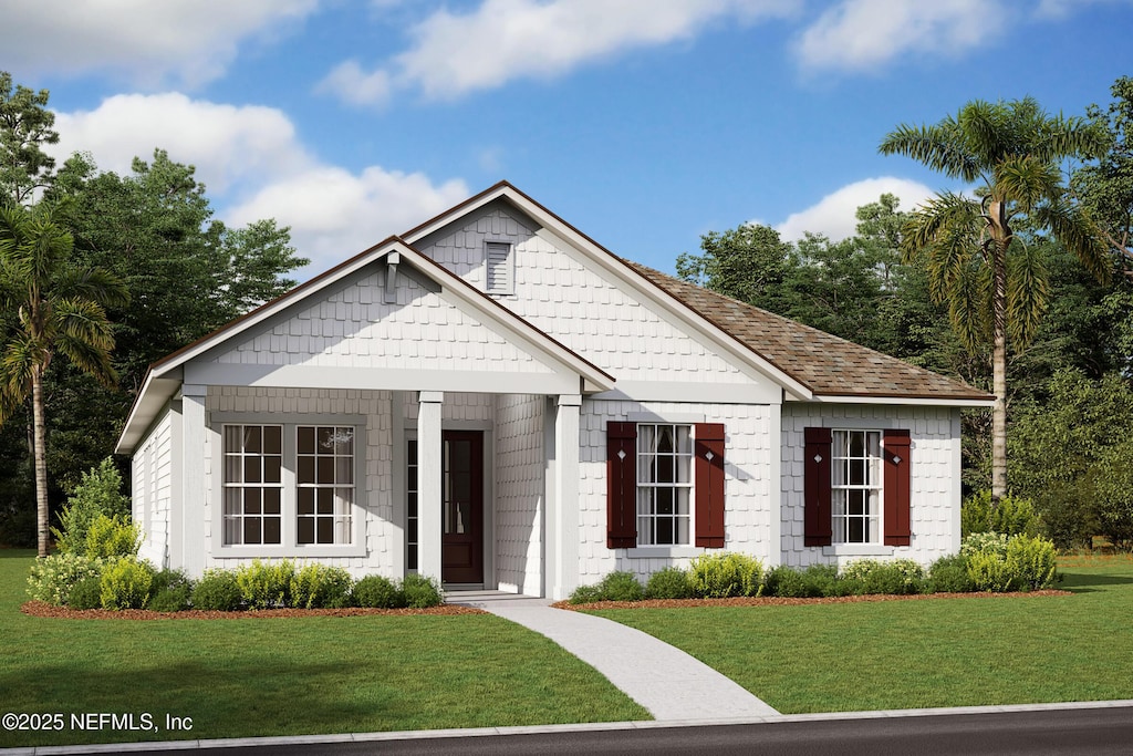 view of front of house featuring a front lawn and roof with shingles