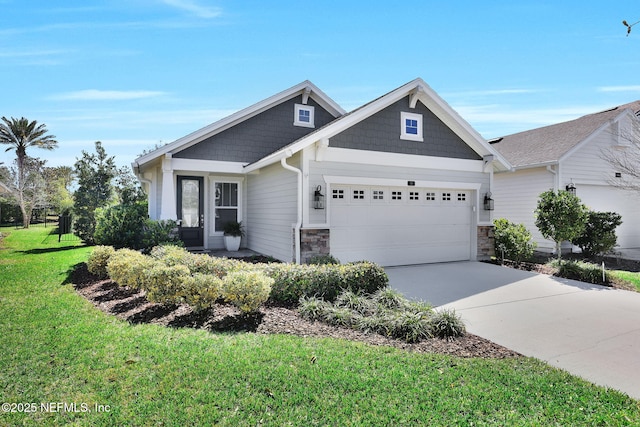 craftsman house featuring a garage, stone siding, concrete driveway, and a front yard