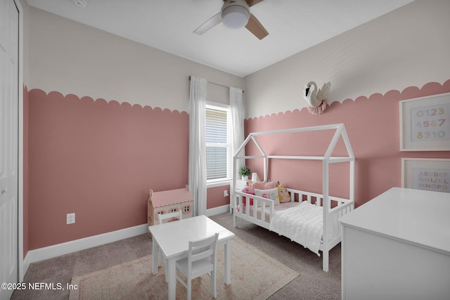 bedroom featuring baseboards, ceiling fan, and carpet flooring