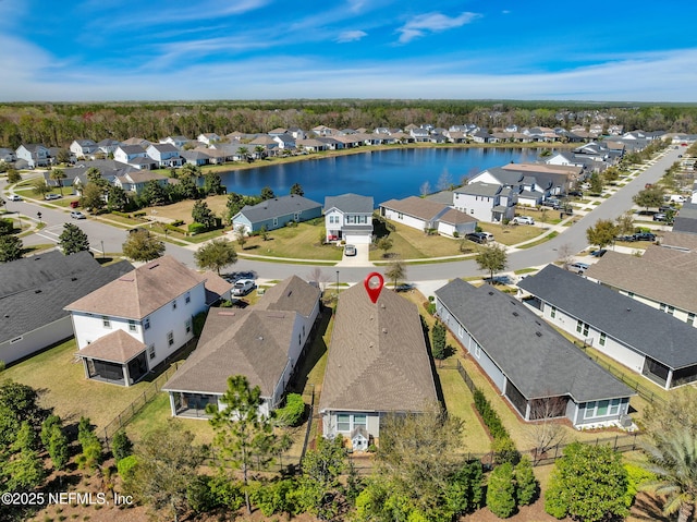 aerial view with a residential view and a water view