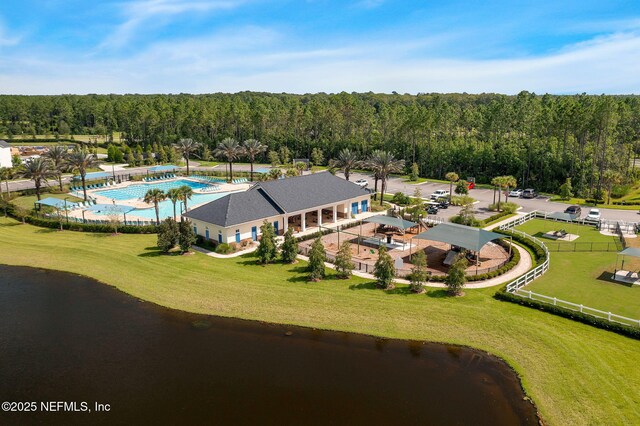 bird's eye view with a view of trees and a water view