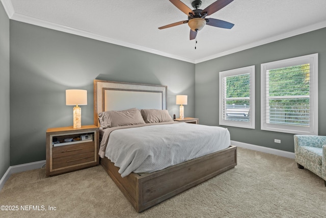 bedroom featuring a textured ceiling, light carpet, a ceiling fan, baseboards, and crown molding