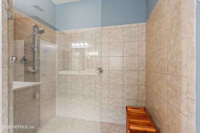 bathroom with visible vents and walk in shower