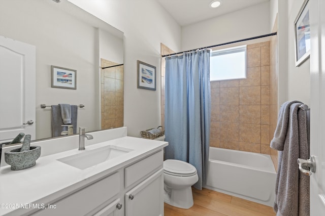 full bathroom with shower / bath combo, vanity, toilet, and wood finished floors