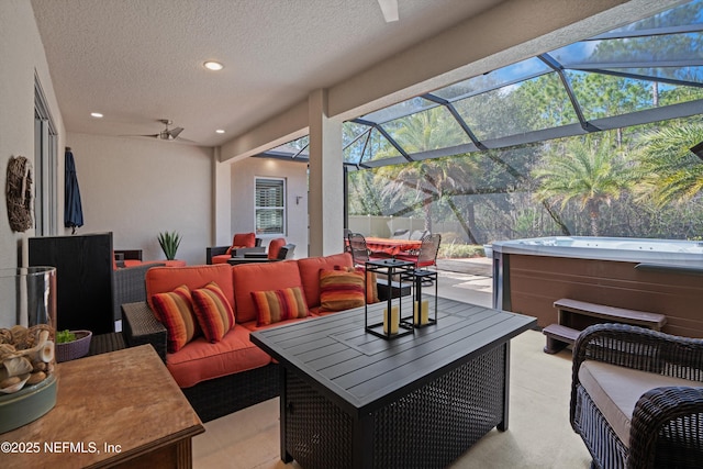 view of patio / terrace featuring an outdoor hangout area, outdoor dining area, a lanai, and a hot tub