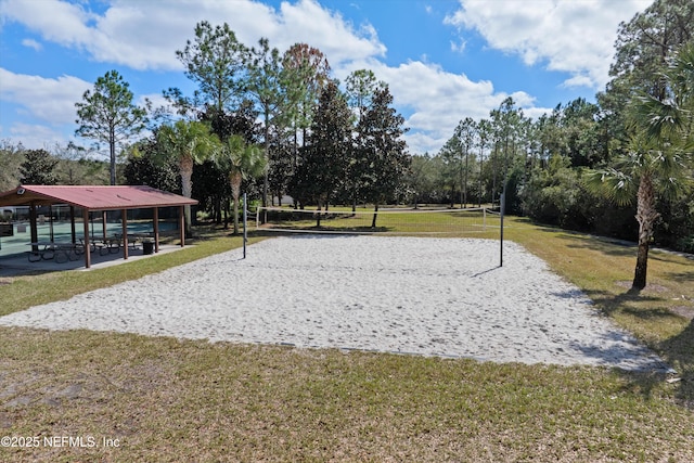 view of home's community featuring volleyball court, a lawn, and a gazebo