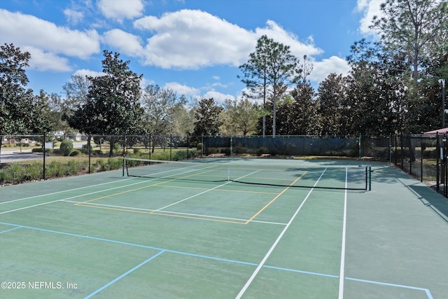 view of sport court featuring fence