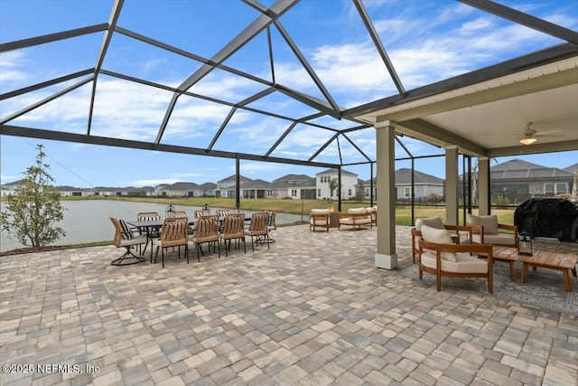 view of patio / terrace with grilling area, an outdoor hangout area, a ceiling fan, a residential view, and a lanai