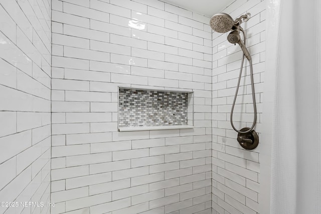 full bath featuring tiled shower