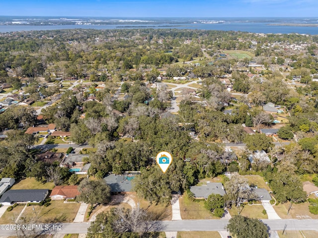 aerial view featuring a wooded view