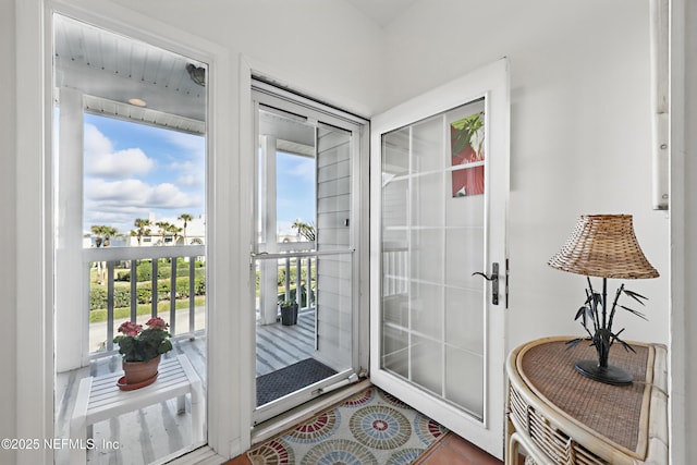 doorway featuring tile patterned flooring