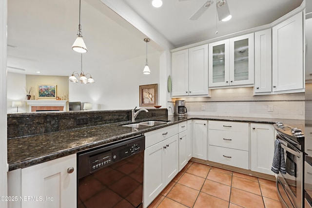 kitchen featuring black dishwasher, white cabinetry, a sink, and backsplash