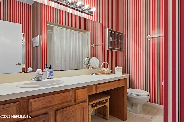 full bath featuring toilet, a shower with curtain, vanity, and tile patterned floors