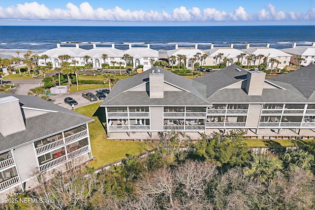 aerial view featuring a residential view and a water view