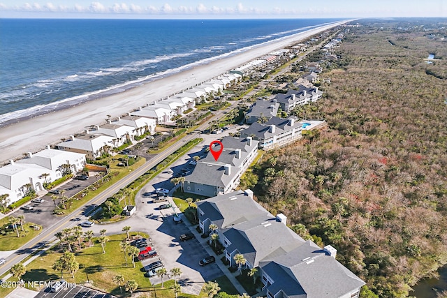 aerial view featuring a residential view, a water view, and a beach view