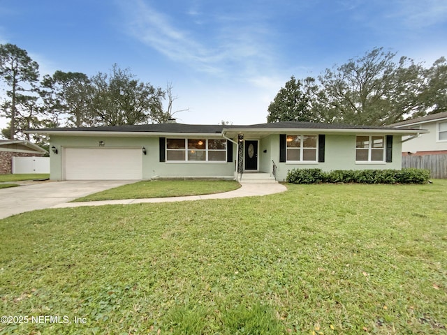 single story home with driveway, an attached garage, fence, a front yard, and stucco siding