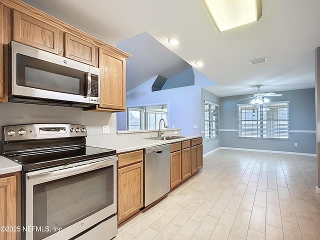 kitchen with visible vents, a ceiling fan, a sink, appliances with stainless steel finishes, and light countertops