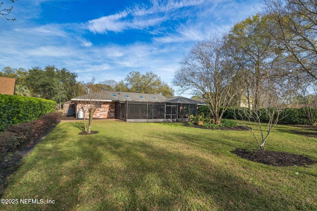 view of yard with a sunroom