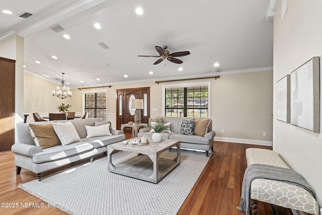 living room featuring ornamental molding, recessed lighting, visible vents, and wood finished floors