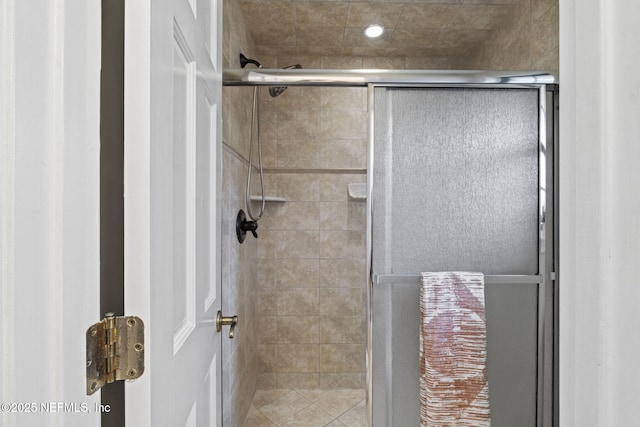 bathroom with a shower stall