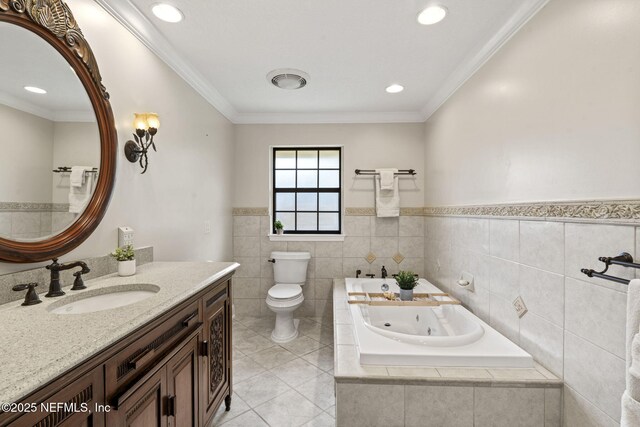 bathroom featuring tile patterned flooring, toilet, vanity, a whirlpool tub, and crown molding