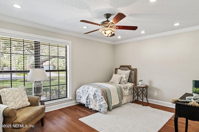 bedroom featuring baseboards, ornamental molding, wood finished floors, a textured ceiling, and recessed lighting