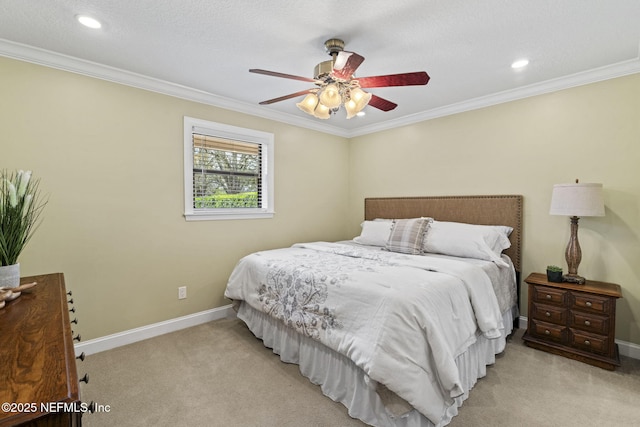 carpeted bedroom featuring baseboards, ceiling fan, recessed lighting, and crown molding